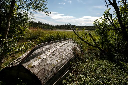 An old abandoned wooden boat by a lake near Are in Sweden on a sunny day
