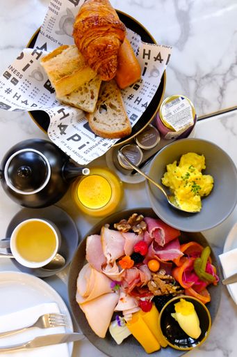 A vertical top shot of an appetizing breakfast with orange juice