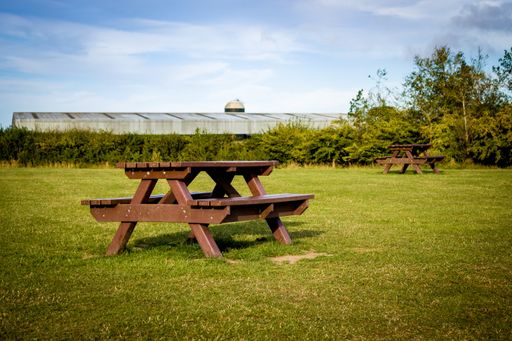 A closeup of the empty picnic tables in Weetslade Country Park, Newcastle upon Tyne, UK