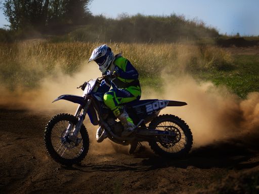 A person on the move riding his Yamaha dirt bike