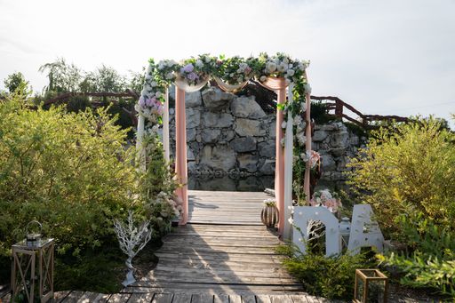 The garden decorated with flowers for a wedding ceremony.