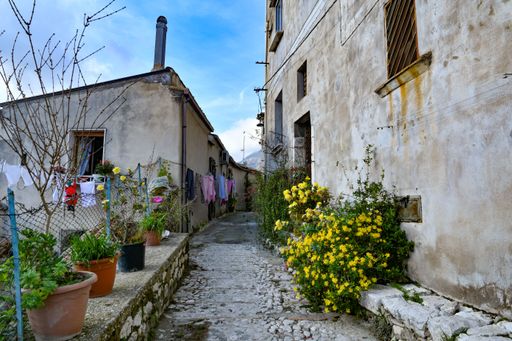A narrow street among the old houses of Montesarchio, a village in the province of Benevento in Italy.