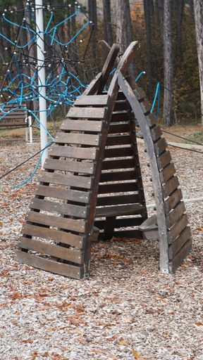 A closeup of a cute children's wooden igloo in the park