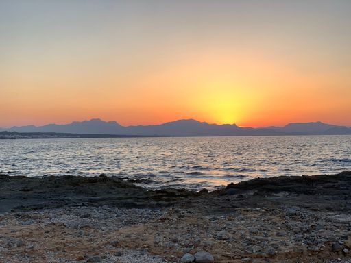 A breathtaking view of a sunset sky over the coast of Palma de Mallorca