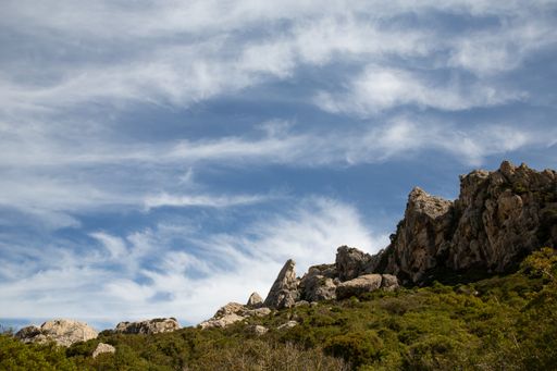 A beautiful rocky landscape under a cloudy sky in Mallorca