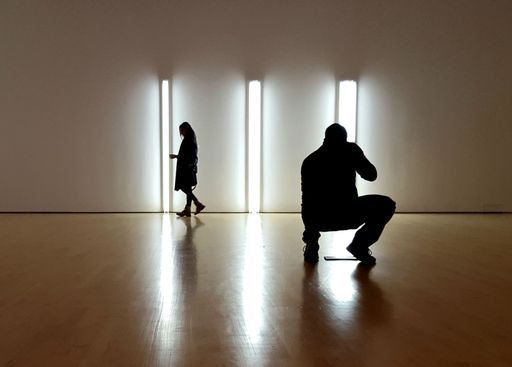 A photographer working inside a museum in Ottawa