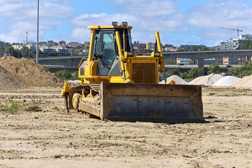 A Crawler bulldozer tractor on the muddy ground