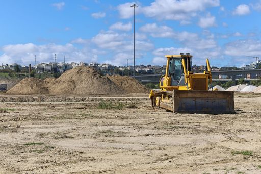 A Crawler bulldozer tractor on the muddy ground
