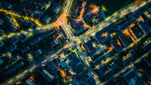 An Aerial view of Timisoara, Romania, featuring a bustling cityscape of buildings and roads.
