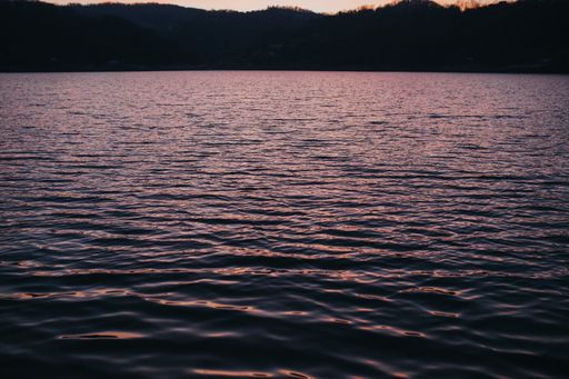A scenery of a breathtaking sunset over the calm sea