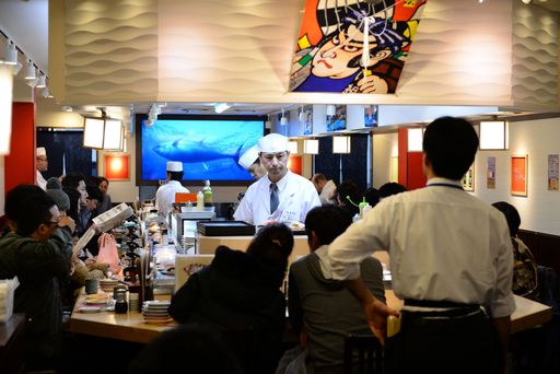 The cooks at the sushi bar in Tokyo, Japan at Christmas time