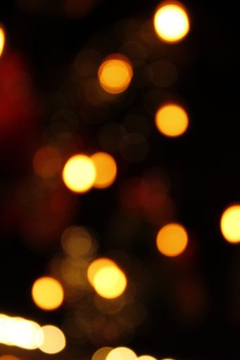 AA vertical shot of the blurred bokeh lights in the darkness