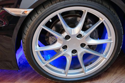 A black sports car silvered wheel