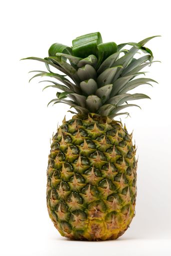 whole natural fresh pineapple isolated on white background