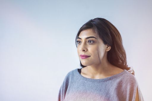 A Hispanic female after a facial treatment in a beauty and spa salon