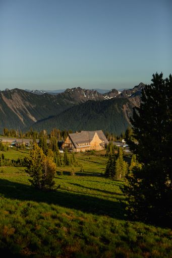 A vertical shot of a building in a mountainous region on a sunny day