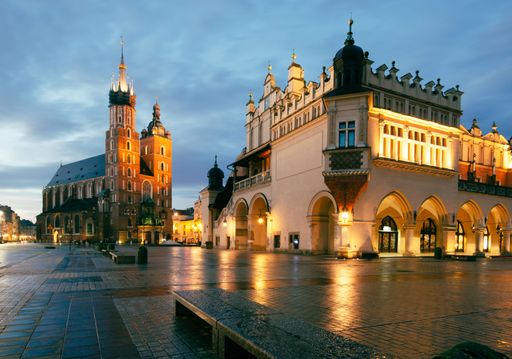 The St. Mary's Church in the evening with a city in the background, in Krakow, Poland