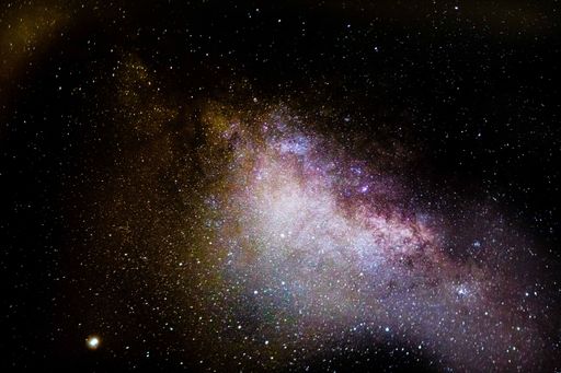 An extraterrestrial night sky surrounded by a multitude of stars