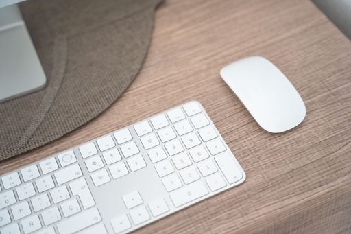 The modern workplace with desktop computer, working table, keyboard and mouse