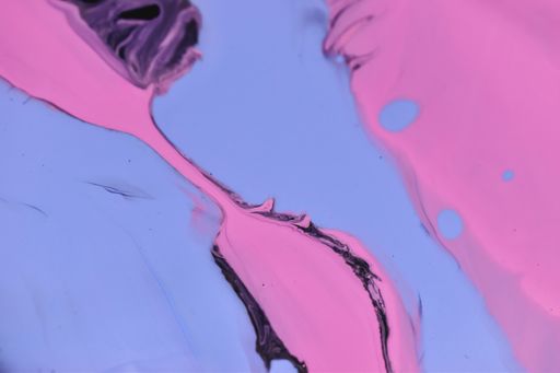 A closeup shot of pink, blue, and purple abstract oil painted waves - perfect for wallpapers