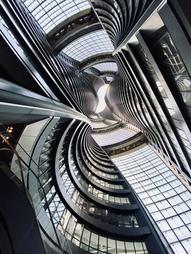 A vertical interior of Leeza SOHO (Li Ze Tower), a Skyscraper in the Lize Financial Business District in Beijing, China