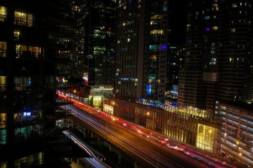 An aerial view of illuminated car light trails on the Gardiner Expressway in Toronto, Canada