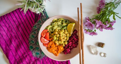 A closeup of a bowl of tasty salad with chickpeas. Top view