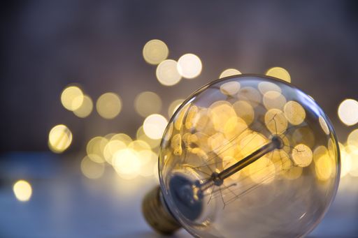 A round light bulb in the beautiful bokeh effect lights background