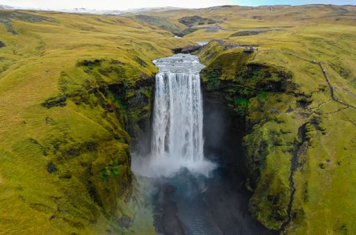 A mesmerizing aerial view of Skogafoss waterfall captured during daylight in Iceland