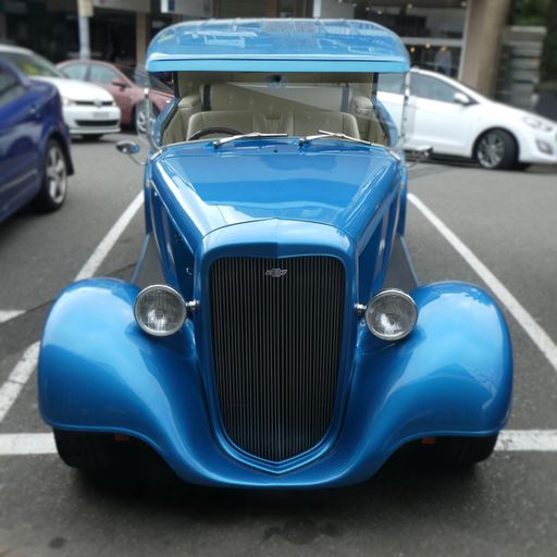 front view of Chevrolet hot rod blue color parked on street