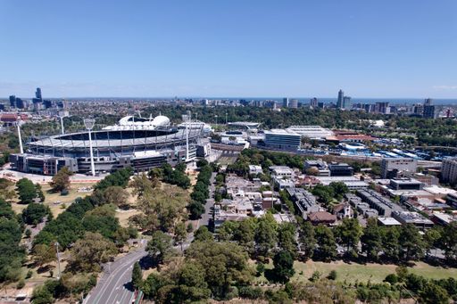 An aerial of train lines running through Melbourne Sports prescient, AAMI park on a sunny day