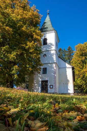 A picturesque old church surrounded by lush greenery. Krahule, Slovakia.