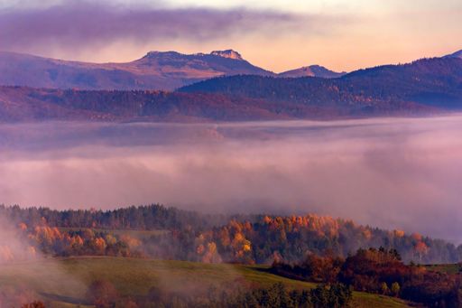 The beautiful view of an autumn valley and hills at sunset. Banska Bystrica, Slovakia.