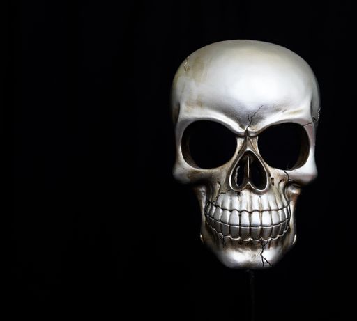 human skull on black background warning danger death symbol