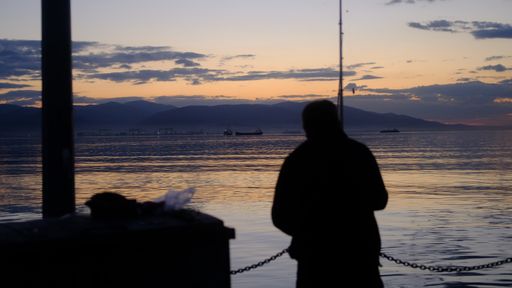 A closeup shot of a male silhouette on a wonderful sunset background
