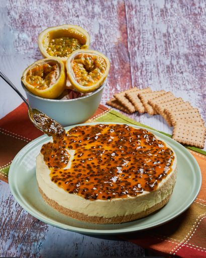 A selective focus shot of delicious cheesecake with passion fruit
