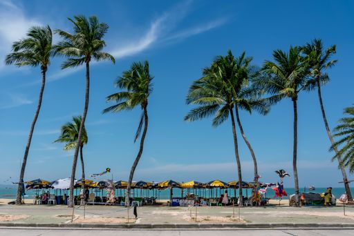 Morning view of sun loungers and umbrellas at Pattaya, Thailand.  Horizontal Shot