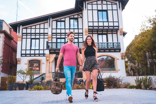 A Caucasian couple leaving the hotel after spending their wonderful vacation
