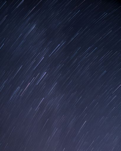 A long exposure shot of the beautiful blurry starry sky for backgrounds and wallpapers