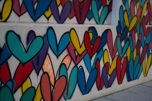 A wall with colorful graffiti