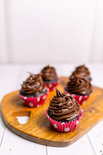 Chocolate caramel cupcake with nuts and butterscotch syrup
