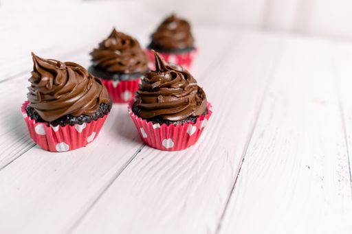 Chocolate caramel cupcake with nuts and butterscotch syrup