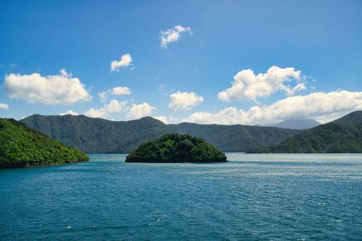 A beautiful view of a pristine lake surrounded by majestic mountain ranges in the South Island of New Zealand