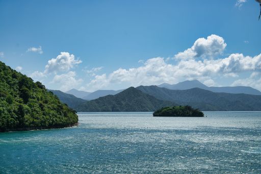 A beautiful view of a pristine lake surrounded by majestic mountain ranges in the South Island of New Zealand