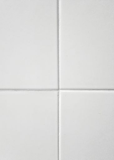 A vertical shot of a bathroom tile wall white texture background