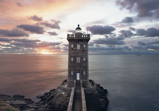 French lighthouse facing a sunset
