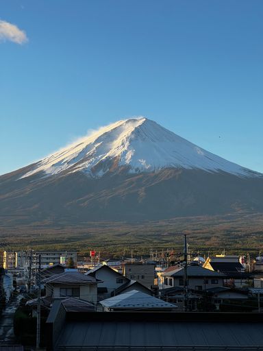 The view of town buildings with Mount Fuji in the background.