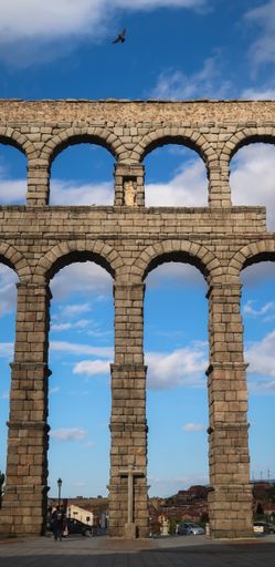 A vertical shot of a Roman aqueduct in Segovia, Spain