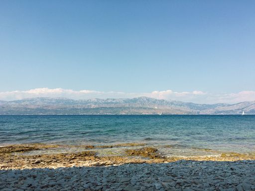 Summer beach view over Brac Island Croatia with views over the water. High Quality Photo.