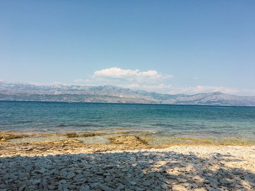 Summer beach view over Brac Island Croatia with views over the water. High Quality Photo.